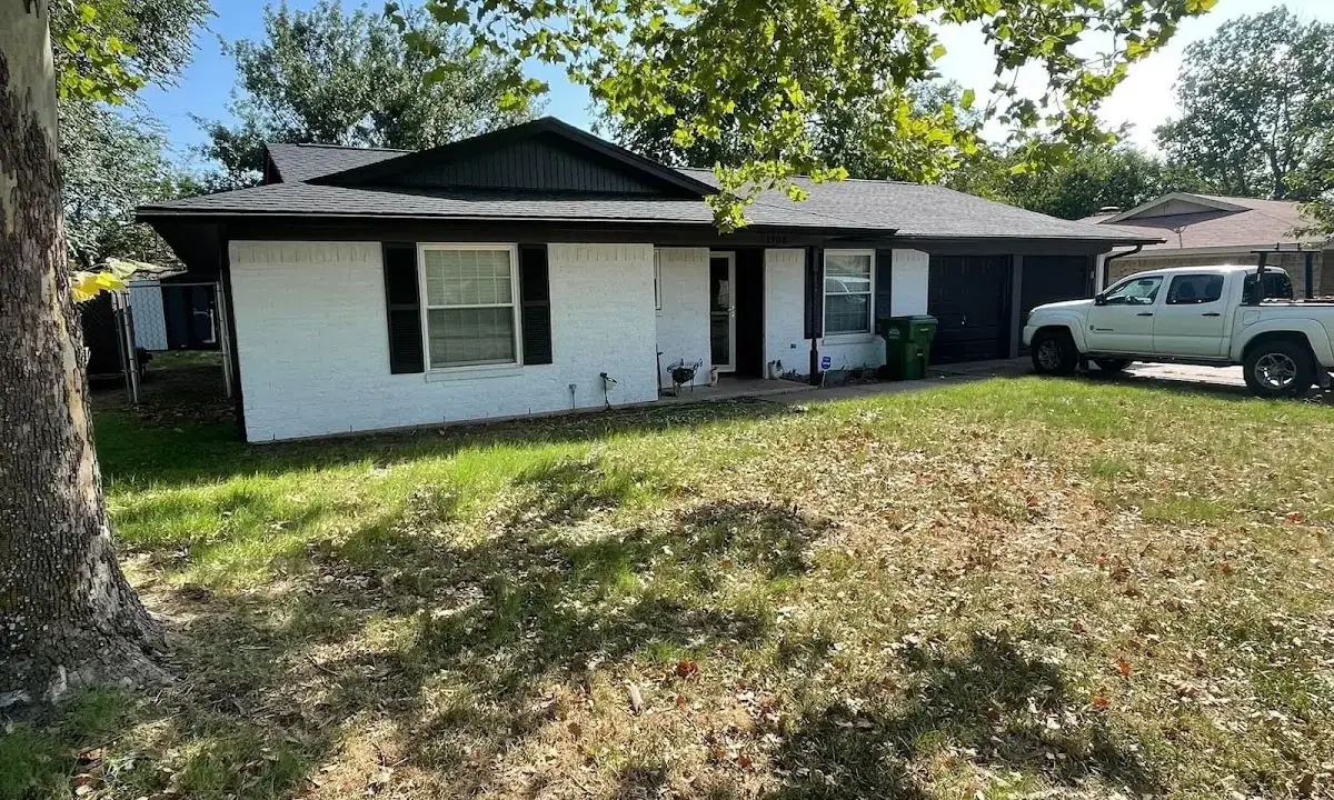 Professional roofing crew working on a residential roof in Eaton